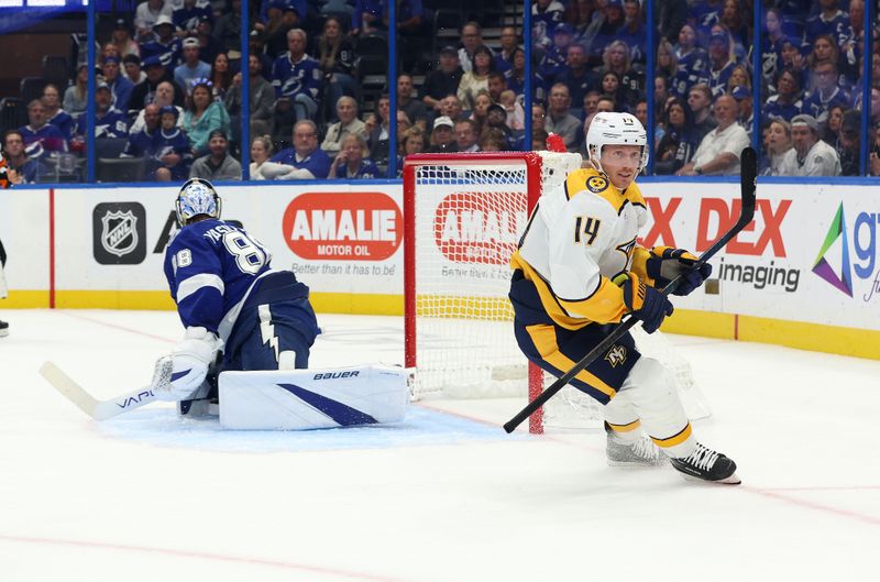 Oct 28, 2024; Tampa, Florida, USA; Nashville Predators center Gustav Nyquist (14) scores a goal on Tampa Bay Lightning goaltender Andrei Vasilevskiy (88) during the second period at Amalie Arena. Mandatory Credit: Kim Klement Neitzel-Imagn Images