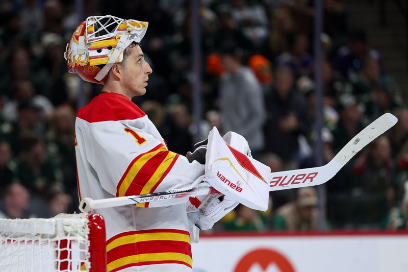 Nov 9, 2025; Saint Paul, Minnesota, USA; Calgary Flames goaltender Devin Cooley (1) looks on during the second period against the Minnesota Wild at Grand Casino Arena. Mandatory Credit: Matt Krohn-Imagn Images