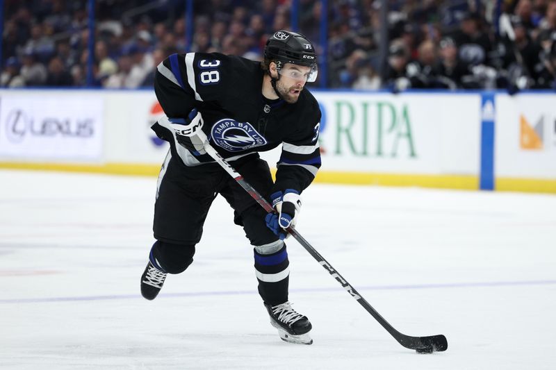 Feb 17, 2024; Tampa, Florida, USA;  Tampa Bay Lightning left wing Brandon Hagel (38) controls the puck against the Florida Panthers in the third period at Amalie Arena. Mandatory Credit: Nathan Ray Seebeck-USA TODAY Sports