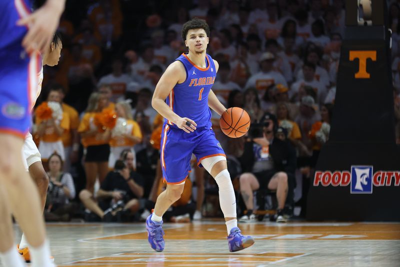 Feb 1, 2025; Knoxville, Tennessee, USA; Florida Gators guard Walter Clayton Jr. (1) brings the ball up court against the Tennessee Volunteers during the second half at Thompson-Boling Arena at Food City Center. Mandatory Credit: Randy Sartin-Imagn Images