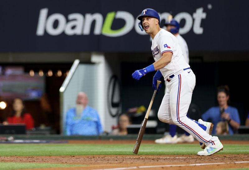 Oct 19, 2023; Arlington, Texas, USA; Texas Rangers first baseman Nathaniel Lowe (30) hits a double during the second inning in game four of the ALCS against the Houston Astros for the 2023 MLB playoffs at Globe Life Field. Mandatory Credit: Andrew Dieb-USA TODAY Sports