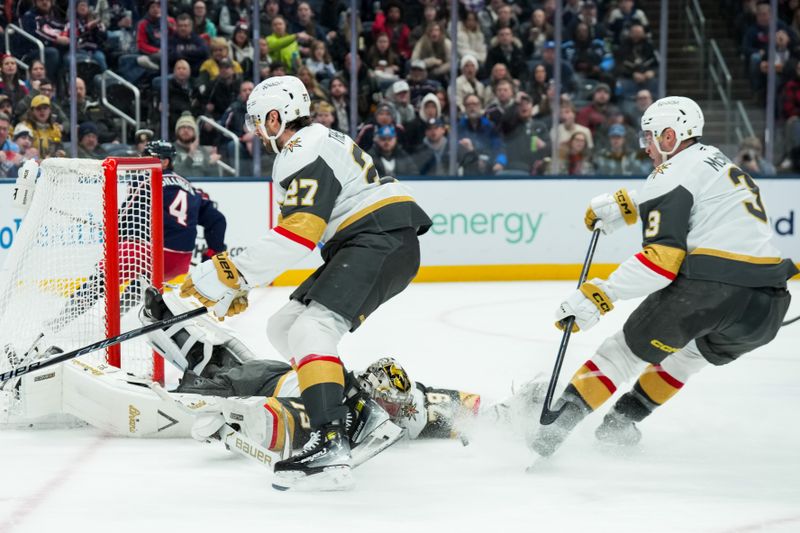 Dec 13, 2025; Columbus, Ohio, USA;  Vegas Golden Knights goaltender Carter Hart (79) makes a save in net against the Columbus Blue Jackets in the second period at Nationwide Arena. Mandatory Credit: Aaron Doster-Imagn Images