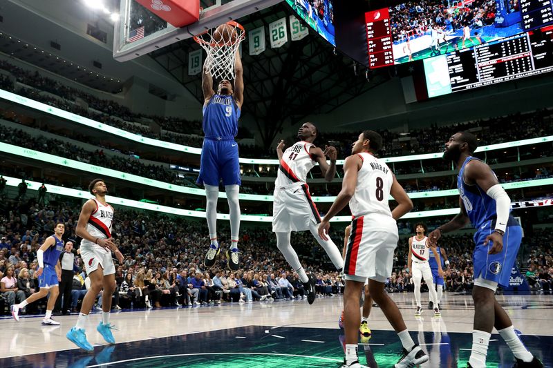 DALLAS, TEXAS - JANUARY 05: A.J. Lawson #9 of the Dallas Mavericks dunks the ball against Ibou Badji #41 of the Portland Trail Blazers in the second half at American Airlines Center on January 05, 2024 in Dallas, Texas. NOTE TO USER: User expressly acknowledges and agrees that, by downloading and or using this photograph, User is consenting to the terms and conditions of the Getty Images License Agreement. (Photo by Tim Heitman/Getty Images)