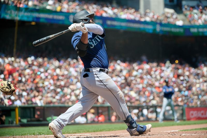 Jul 4, 2023; San Francisco, California, USA; Seattle Mariners infielder Mike Ford (20) hits a solo run home run against the San Francisco Giants during the third inning at Oracle Park. Mandatory Credit: Robert Edwards-USA TODAY Sports