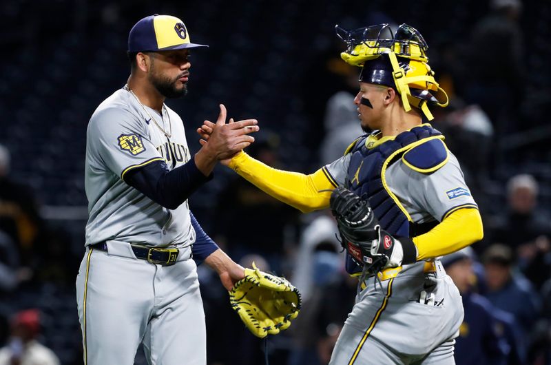 Apr 24, 2024; Pittsburgh, Pennsylvania, USA;  Milwaukee Brewers relief pitcher Joel Payamps (31) and catcher William Contreras (24) shake hands after defeating the Pittsburgh Pirates at PNC Park. The Brewers won 3-2. Mandatory Credit: Charles LeClaire-USA TODAY Sports