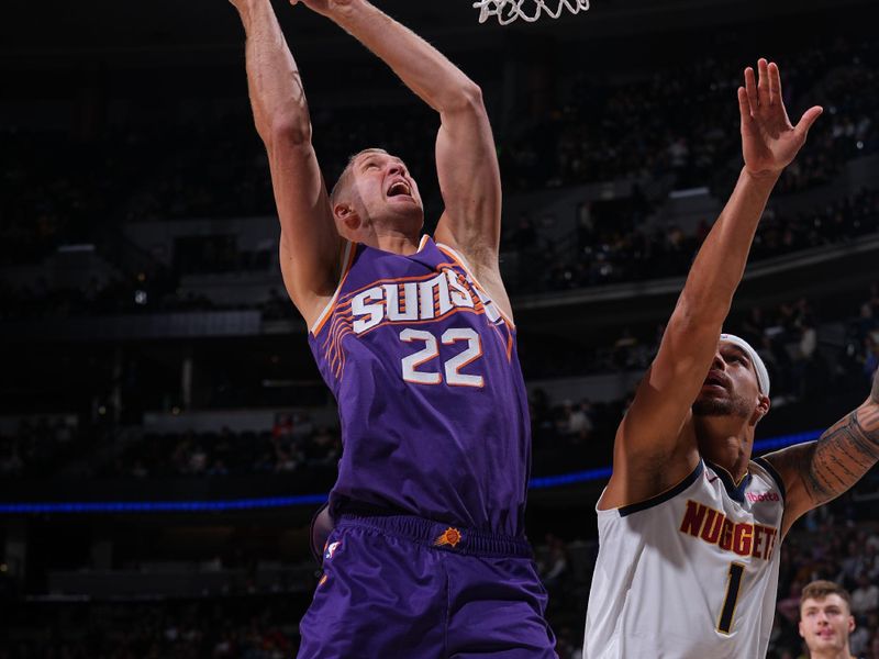 DENVER, CO - OCTOBER 13: Mason Plumlee #22 of the Phoenix Suns drives to the basket during the game against the Denver Nuggets on October 13, 2024 at Ball Arena in Denver, Colorado. NOTE TO USER: User expressly acknowledges and agrees that, by downloading and/or using this Photograph, user is consenting to the terms and conditions of the Getty Images License Agreement. Mandatory Copyright Notice: Copyright 2024 NBAE (Photo by Bart Young/NBAE via Getty Images)