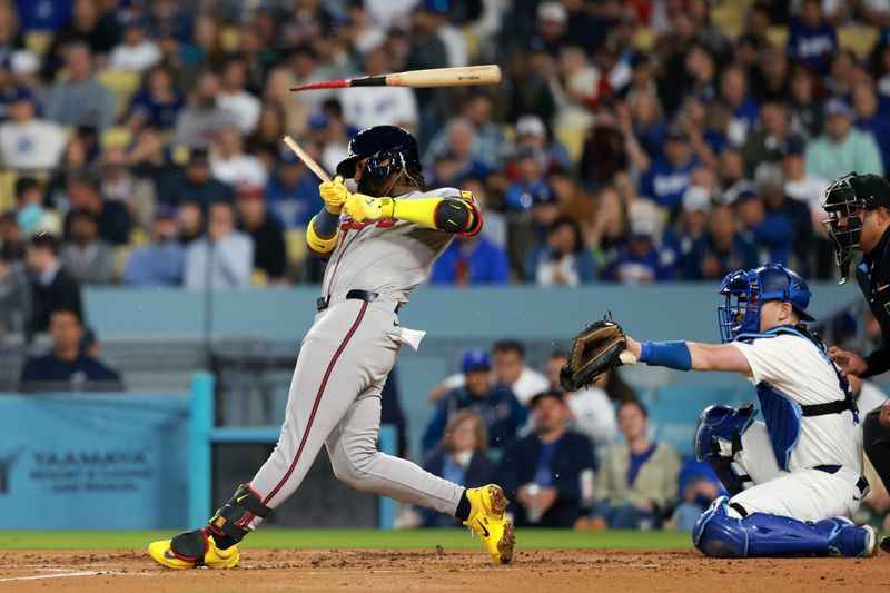 May 3, 2024; Los Angeles, California, USA;  Atlanta Braves outfielder Ronald Acuna Jr. (13) breaks a bat in the third inning against the Los Angeles Dodgers at Dodger Stadium. Mandatory Credit: Kiyoshi Mio-USA TODAY Sports