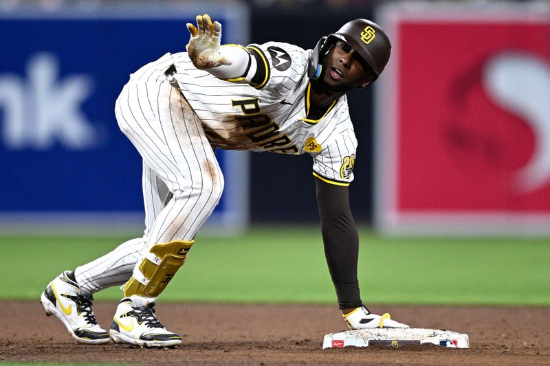 Apr 30, 2024; San Diego, California, USA; San Diego Padres left fielder Jurickson Profar (10) requests time after hitting a double against the Cincinnati Reds during the sixth inning at Petco Park. Mandatory Credit: Orlando Ramirez-USA TODAY Sports