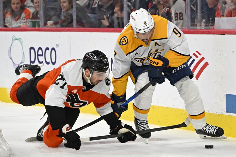 Oct 30, 2025; Philadelphia, Pennsylvania, USA; Philadelphia Flyers left wing Noah Cates (27) and Nashville Predators left wing Filip Forsberg (9) battle for the puck during the second period at Xfinity Mobile Arena. Mandatory Credit: Eric Hartline-Imagn Images