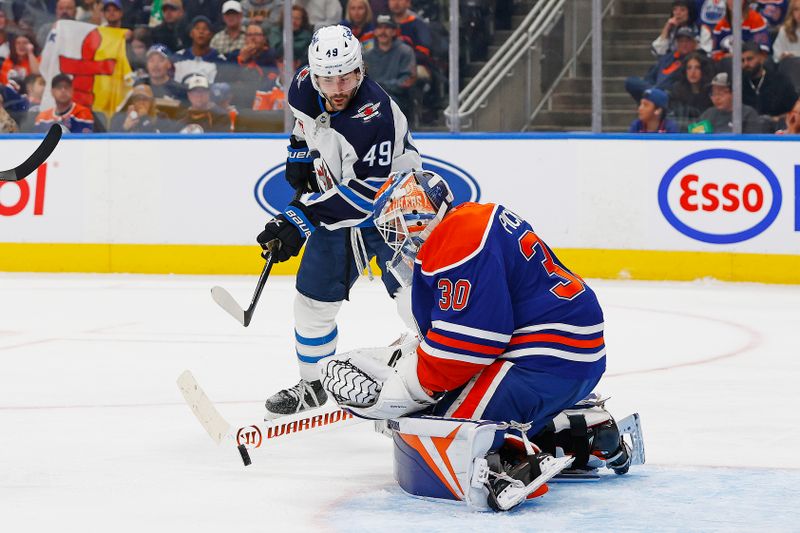 Sep 26, 2025; Edmonton, Alberta, CAN; Winnipeg Jets forward Colby Barlow (49) looks for a rebound in front of Edmonton Oilers goaltender Calvin Pickard (30) during the second period at Rogers Place. Mandatory Credit: Perry Nelson-Imagn Images