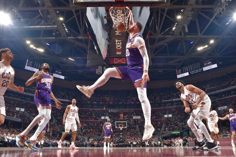CLEVELAND, OH - MARCH 11: Jusuf Nurkic #20 of the Phoenix Suns dunks the ball during the game against the Cleveland Cavaliers on March 11, 2024 at Rocket Mortgage FieldHouse in Cleveland, Ohio. NOTE TO USER: User expressly acknowledges and agrees that, by downloading and/or using this Photograph, user is consenting to the terms and conditions of the Getty Images License Agreement. Mandatory Copyright Notice: Copyright 2024 NBAE (Photo by David Liam Kyle/NBAE via Getty Images)