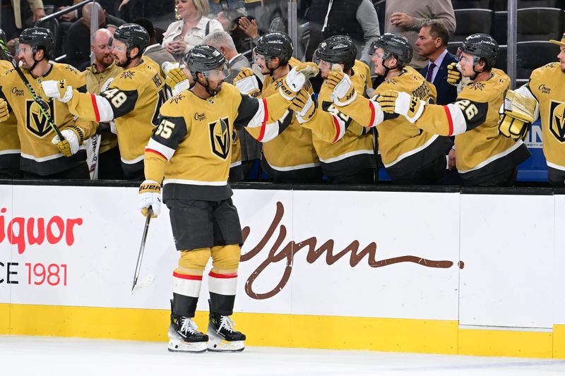 Oct 28, 2024; Las Vegas, Nevada, USA; Vegas Golden Knights right wing Keegan Kolesar (55) celebrates his third period goal against the Calgary Flames at T-Mobile Arena. Mandatory Credit: Candice Ward-Imagn Images