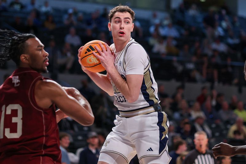 Jan 3, 2026; Atlanta, Georgia, USA; Georgia Tech Yellow Jackets guard Kam Craft (12) grabs a rebound against the Boston College Eagles in the first half at McCamish Pavilion. Mandatory Credit: Brett Davis-Imagn Images