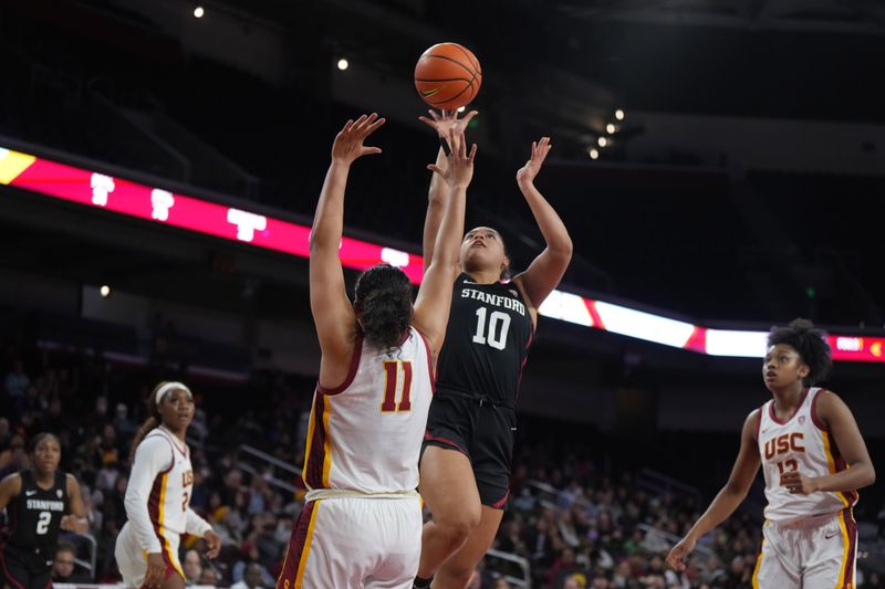 Jan 15, 2023; Los Angeles, California, USA; Stanford Cardinal guard Talana Lepolo (10) shoots the ball against Southern California Trojans guard Destiny Littleton (11) in the first half at Galen Center.  USC defeated Stanford 55-46. Mandatory Credit: Kirby Lee-USA TODAY Sports