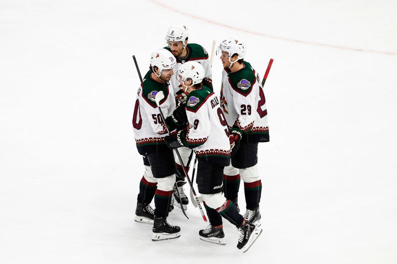 Mar 10, 2024; Chicago, Illinois, USA; Arizona Coyotes right wing Clayton Keller (9) celebrates with teammates after scoring against the Chicago Blackhawks during the first period at United Center. Mandatory Credit: Kamil Krzaczynski-USA TODAY Sports