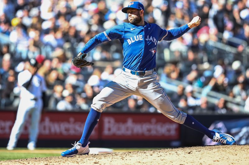 Apr 7, 2024; Bronx, New York, USA;  Toronto Blue Jays relief pitcher Tim Mayza (58) pitches in the eighth inning against the New York Yankees at Yankee Stadium. Mandatory Credit: Wendell Cruz-USA TODAY Sports