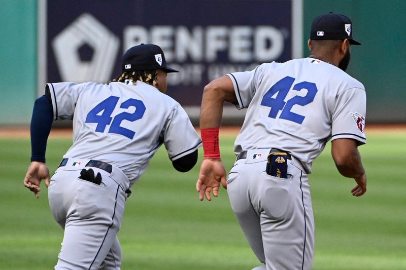 Apr 15, 2023; Washington, District of Columbia, USA; Cleveland Guardians third baseman Jose Ramirez (left) and Cleveland Guardians shortstop Amed Rosario wear #42 to honor Jackie Robinson before the game against the Washington Nationals at Nationals Park. Mandatory Credit: Brad Mills-USA TODAY Sports