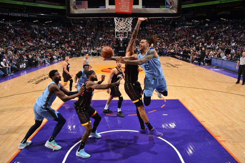 PHOENIX, AZ - FEBRUARY 11:  Brandon Clarke #15 of the Memphis Grizzlies drives to the basket during the game on February 11, 2025 at Footprint Center in Phoenix, Arizona. NOTE TO USER: User expressly acknowledges and agrees that, by downloading and or using this photograph, user is consenting to the terms and conditions of the Getty Images License Agreement. Mandatory Copyright Notice: Copyright 2025 NBAE (Photo by Barry Gossage/NBAE via Getty Images)