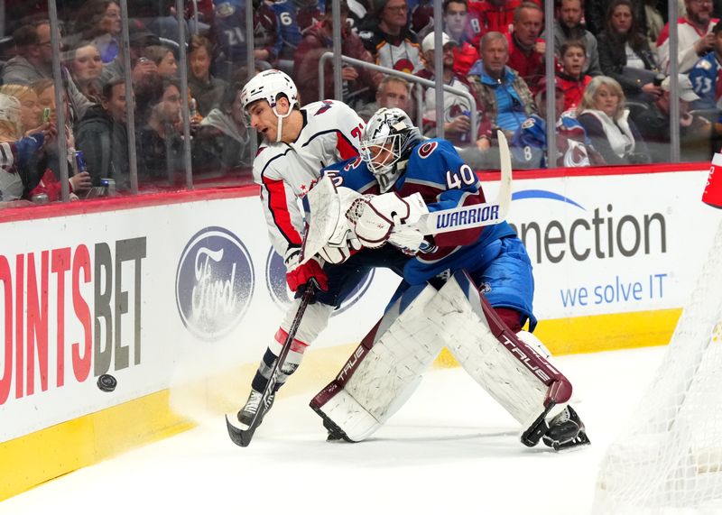 Jan 24, 2023; Denver, Colorado, USA; Colorado Avalanche goaltender Alexandar Georgiev (40) collides into Washington Capitals right wing Garnet Hathaway (21) in the first period at Ball Arena. Mandatory Credit: Ron Chenoy-USA TODAY Sports