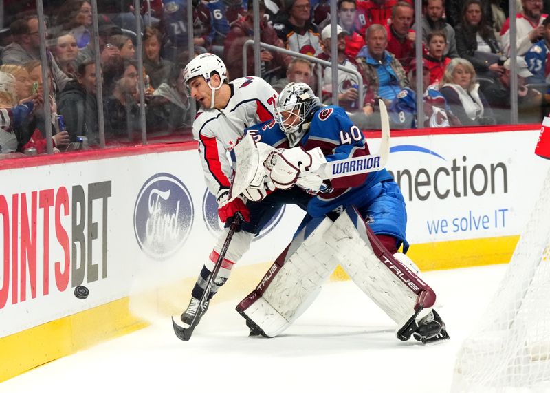 Jan 24, 2023; Denver, Colorado, USA; Colorado Avalanche goaltender Alexandar Georgiev (40) collides into Washington Capitals right wing Garnet Hathaway (21) in the first period at Ball Arena. Mandatory Credit: Ron Chenoy-USA TODAY Sports