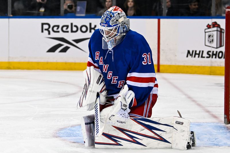 Dec 2, 2024; New York, New York, USA;  New York Rangers goaltender Igor Shesterkin (31) makes a save against the New Jersey Devils during the third period at Madison Square Garden. Mandatory Credit: Dennis Schneidler-Imagn Images