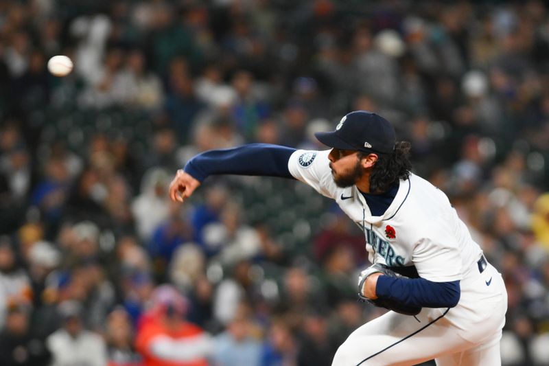 May 27, 2024; Seattle, Washington, USA; Seattle Mariners relief pitcher Andres Munoz (75) pitches to the Houston Astros during the ninth inning at T-Mobile Park. Mandatory Credit: Steven Bisig-USA TODAY Sports