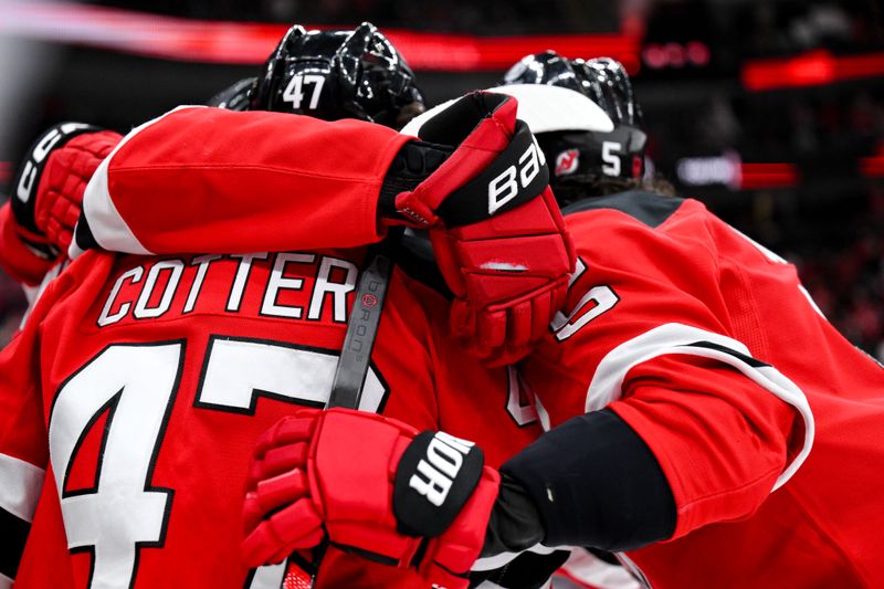 Dec 13, 2025; Newark, New Jersey, USA; New Jersey Devils left wing Paul Cotter (47) celebrates with teammates after scoring a goal against the Anaheim Ducks during the second period at Prudential Center. Mandatory Credit: John Jones-Imagn Images