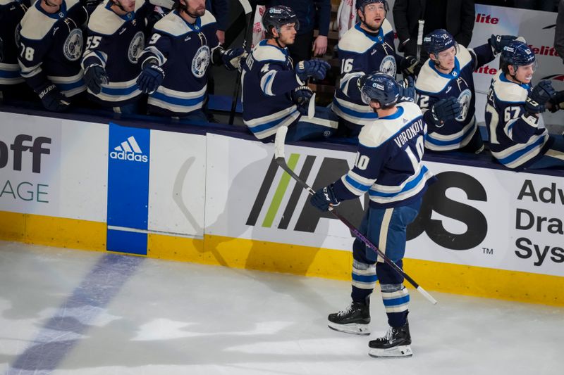 Apr 4, 2024; Columbus, Ohio, USA;  Columbus Blue Jackets left wing Dmitri Voronkov (10) celebrates with teammates after scoring a goal against the New York Islanders in the first period at Nationwide Arena. Mandatory Credit: Aaron Doster-USA TODAY Sports