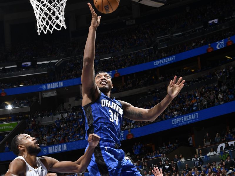 ORLANDO, FL - APRIL 27: Wendell Carter Jr. #34 of the Orlando Magic drives to the basket during the game against the Cleveland Cavaliers during Round 1 Game 4 of the 2024 NBA Playoffs on April 27, 2024 at the Kia Center in Orlando, Florida. NOTE TO USER: User expressly acknowledges and agrees that, by downloading and or using this photograph, User is consenting to the terms and conditions of the Getty Images License Agreement. Mandatory Copyright Notice: Copyright 2024 NBAE (Photo by Fernando Medina/NBAE via Getty Images)