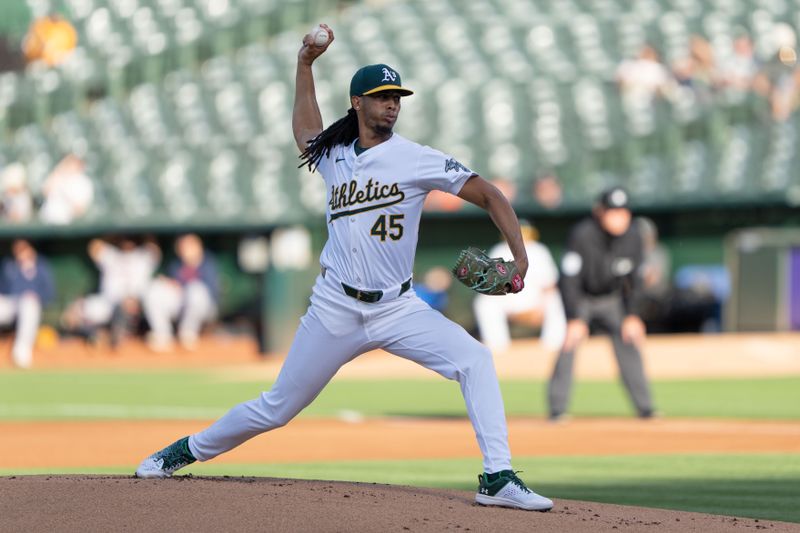 Jul 23, 2024; Oakland, California, USA;  Oakland Athletics pitcher Osvaldo Bido (45) pitches during the first inning against the Houston Astros at Oakland-Alameda County Coliseum. Mandatory Credit: Stan Szeto-USA TODAY Sports