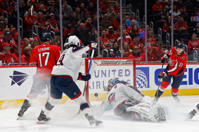 Nov 2, 2024; Washington, District of Columbia, USA; Washington Capitals center Aliaksei Protas (21) scores a goal on Columbus Blue Jackets goaltender Daniil Tarasov (40) in the first period at Capital One Arena. Mandatory Credit: Geoff Burke-Imagn Images