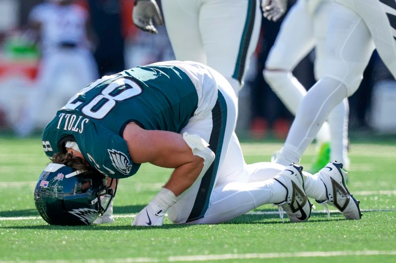 Philadelphia Eagles tight end Jack Stoll is slow to get up after a play against the Cincinnati Bengals during the second half of an NFL football game, Sunday, Oct. 27, 2024 in Cincinnati. (AP Photo/Carolyn Kaster)