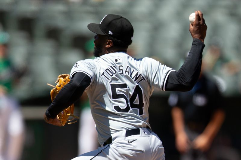 Aug 7, 2024; Oakland, California, USA; Chicago White Sox pitcher Touki Toussaint (54) delivers against the Oakland Athletics during the seventh inning at Oakland-Alameda County Coliseum. Mandatory Credit: D. Ross Cameron-USA TODAY Sports