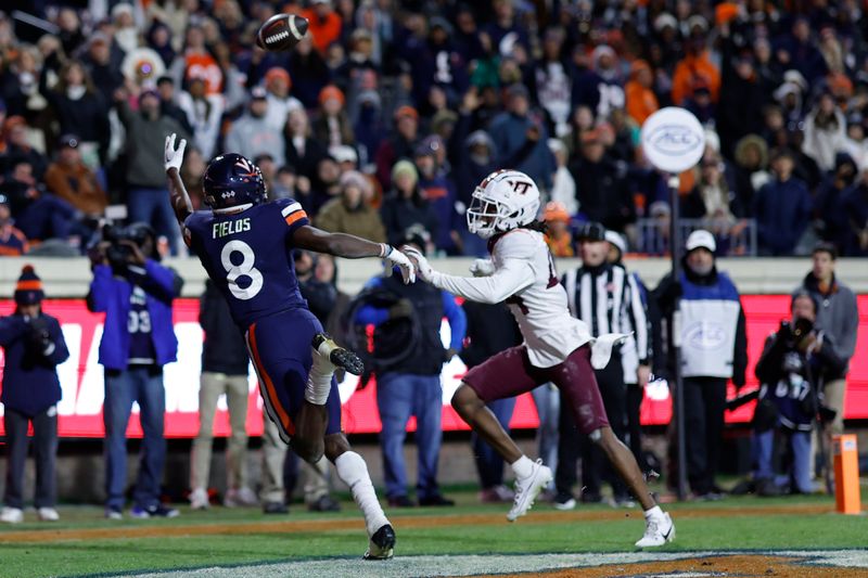 Nov 25, 2023; Charlottesville, Virginia, USA; Virginia Cavaliers wide receiver Malachi Fields (8) attempts to catch a touchdown pass as Virginia Tech Hokies cornerback Dorian Strong (44) defends during the fourth quarter at Scott Stadium. Mandatory Credit: Geoff Burke-USA TODAY Sports