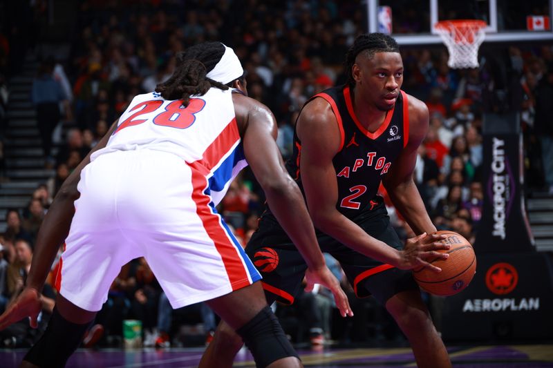 TORONTO, CANADA - NOVEMBER 15: Jonathan Mogbo #2 of the Toronto Raptors handles the ball during the game against the Detroit Pistons during the Emirates NBA Cup game on November 15, 2024 at the Scotiabank Arena in Toronto, Ontario, Canada.  NOTE TO USER: User expressly acknowledges and agrees that, by downloading and or using this Photograph, user is consenting to the terms and conditions of the Getty Images License Agreement.  Mandatory Copyright Notice: Copyright 2024 NBAE (Photo by Vaughn Ridley/NBAE via Getty Images)