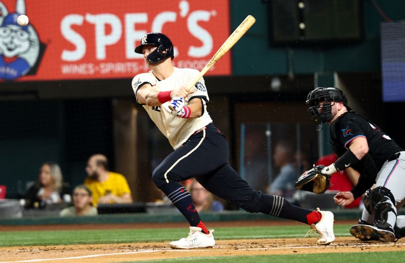 Sep 19, 2025; Arlington, Texas, USA;  Texas Rangers third baseman Josh Jung (6) hits an rbi single during the second inning against the Miami Marlins at Globe Life Field. Mandatory Credit: Kevin Jairaj-Imagn Images