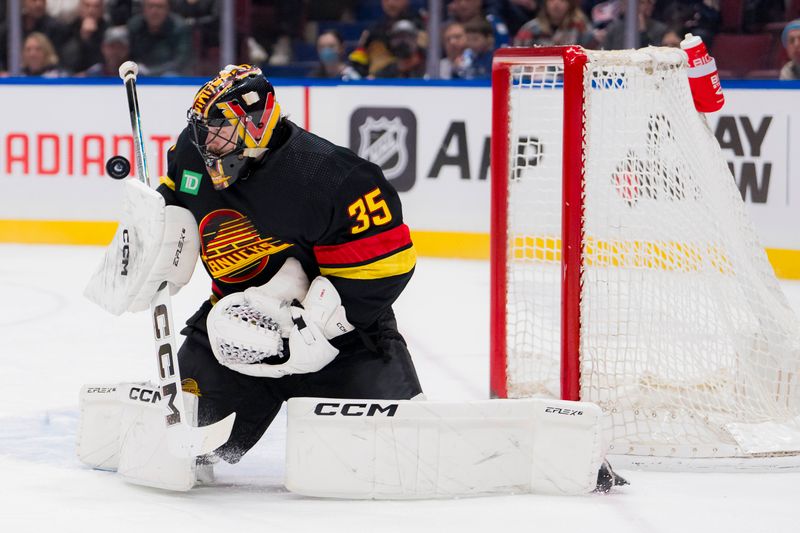 Jan 27, 2024; Vancouver, British Columbia, CAN; Vancouver Canucks goalie Thatcher Demko (35) makes a save against the Columbus Blue Jackets in the third period at Rogers Arena. Canucks won 5-4 in overtime. Mandatory Credit: Bob Frid-USA TODAY Sports