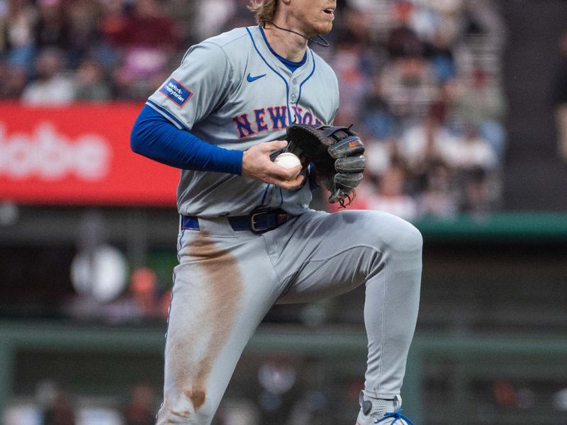 Apr 23, 2024; San Francisco, California, USA; New York Mets third base Brett Baty (22) fields the ball at third base during the third inning against the San Francisco Giants at Oracle Park. Mandatory Credit: Ed Szczepanski-USA TODAY Sports