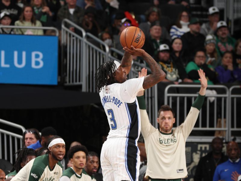 MILWAUKEE, WI - JANUARY 15:  Kentavious Caldwell-Pope #3 of the Orlando Magic shoots the ball during the game against the Milwaukee Bucks on January 15, 2025 at Fiserv Forum Center in Milwaukee, Wisconsin. NOTE TO USER: User expressly acknowledges and agrees that, by downloading and or using this Photograph, user is consenting to the terms and conditions of the Getty Images License Agreement. Mandatory Copyright Notice: Copyright 2025 NBAE (Photo by Gary Dineen/NBAE via Getty Images).