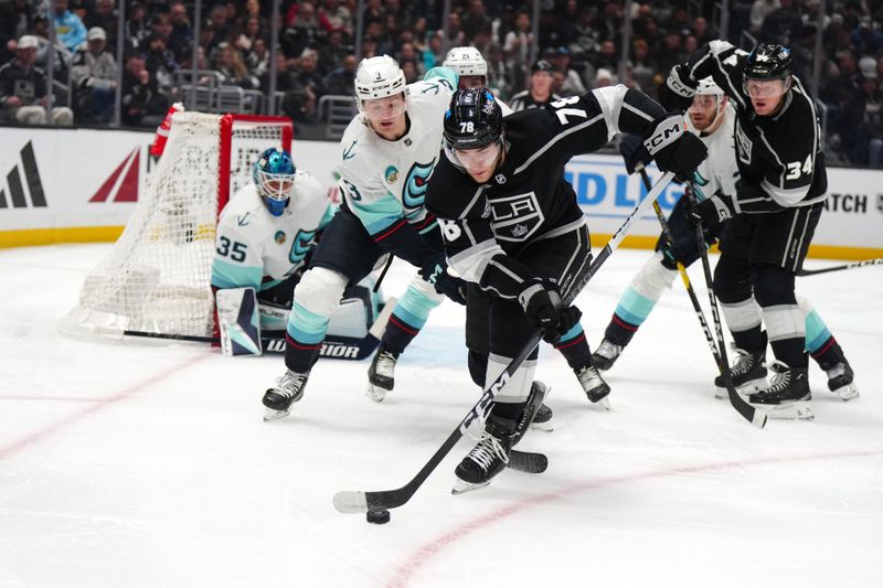 Dec 20, 2023; Los Angeles, California, USA; LA Kings right wing Alex Laferriere (78) and Seattle Kraken defenseman Will Borgen (3) battle for puck in the second period at Crypto.com Arena. Mandatory Credit: Kirby Lee-USA TODAY Sports