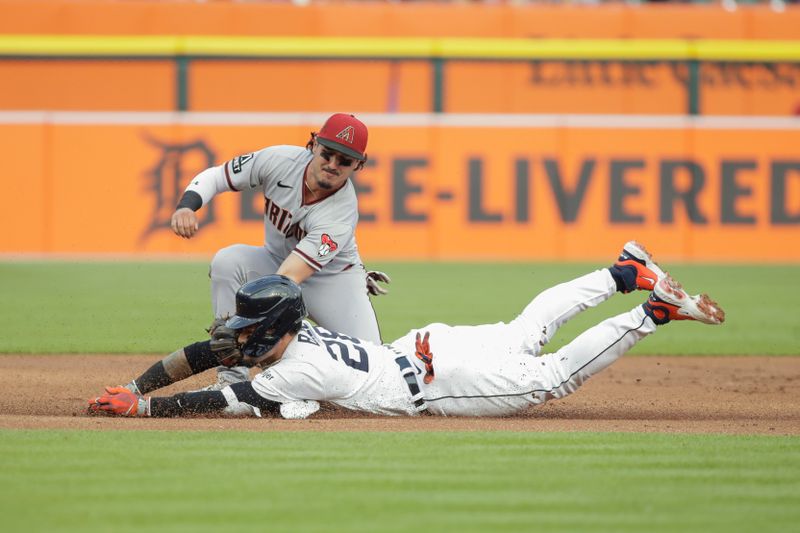 Jun 9, 2023; Detroit, Michigan, USA; Arizona Diamondbacks shortstop Josh Rojas (10) tags out Detroit Tigers Javier B ez (28) at third base during the first inning at Comerica Park. Mandatory Credit: Brian Bradshaw Sevald-USA TODAY Sports