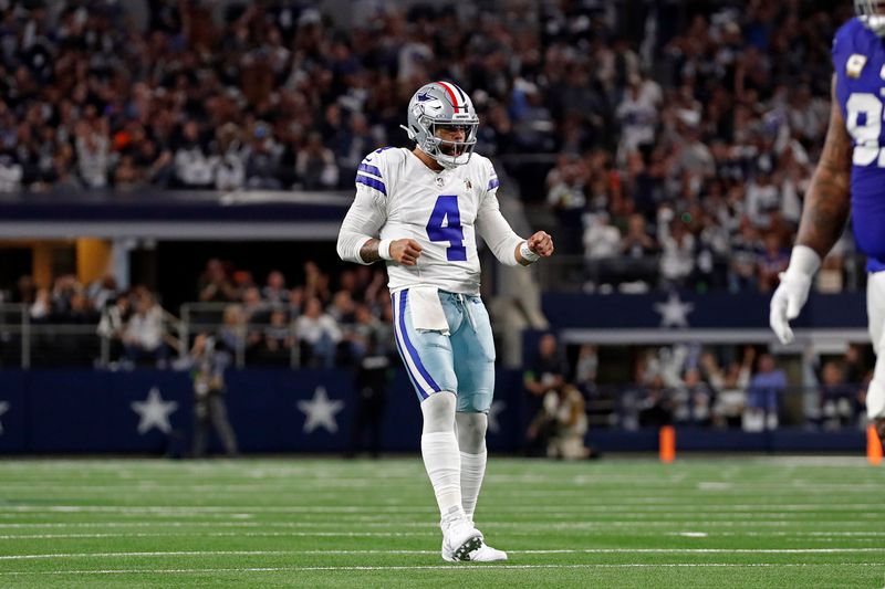 Dallas Cowboys quarterback Dak Prescott (4) celebrates after a play during an NFL football game against the New York Giants, Sunday, Nov. 12, 2023, in Arlington, TX. (AP Photo/Tyler Kaufman)