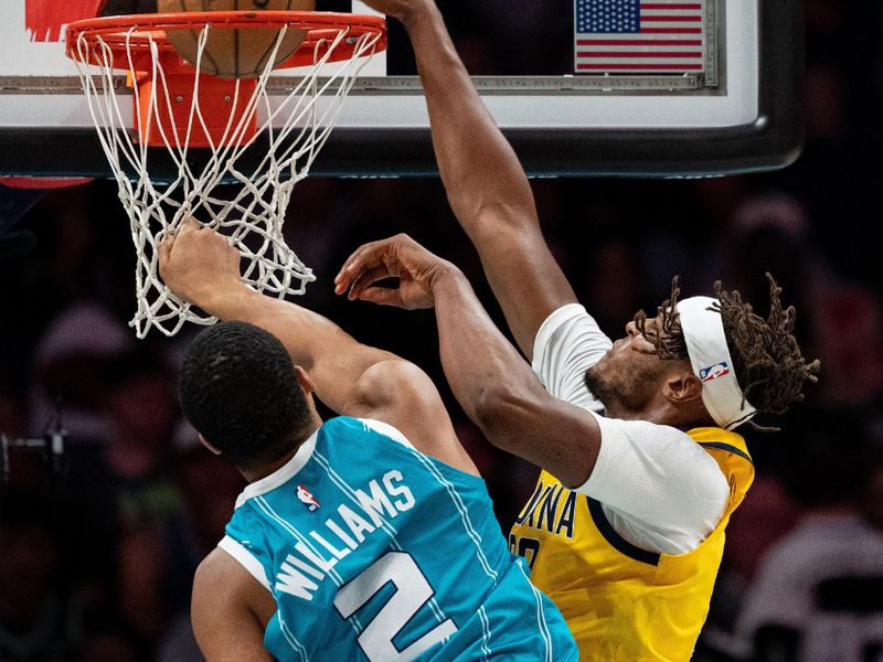 CHARLOTTE, NORTH CAROLINA - NOVEMBER 08: Myles Turner #33 of the Indiana Pacers dunks the ball while guarded by Grant Williams #2 of the Charlotte Hornets in the third quarter during their game at Spectrum Center on November 08, 2024 in Charlotte, North Carolina. NOTE TO USER: User expressly acknowledges and agrees that, by downloading and or using this photograph, User is consenting to the terms and conditions of the Getty Images License Agreement. (Photo by Jacob Kupferman/Getty Images)