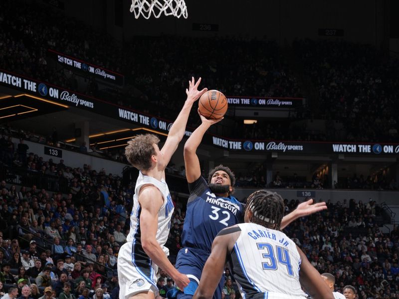 MINNEAPOLIS, MN -  FEBRUARY 2: Karl-Anthony Towns #32 of the Minnesota Timberwolves drives to the basket during the game against the Orlando Magic on February 2, 2024 at Target Center in Minneapolis, Minnesota. NOTE TO USER: User expressly acknowledges and agrees that, by downloading and or using this Photograph, user is consenting to the terms and conditions of the Getty Images License Agreement. Mandatory Copyright Notice: Copyright 2024 NBAE (Photo by Jordan Johnson/NBAE via Getty Images)