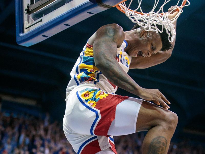 Feb 18, 2023; Lawrence, Kansas, USA; Kansas Jayhawks forward K.J. Adams Jr. (24) reacts after dunking against the Baylor Bears during the second half at Allen Fieldhouse. Mandatory Credit: William Purnell-USA TODAY Sports