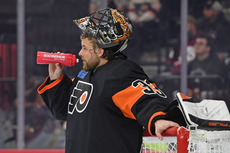 Oct 31, 2024; Philadelphia, Pennsylvania, USA; Philadelphia Flyers goaltender Samuel Ersson (33) during a break against the St. Louis Blues during the second period at Wells Fargo Center. Mandatory Credit: Eric Hartline-Imagn Images