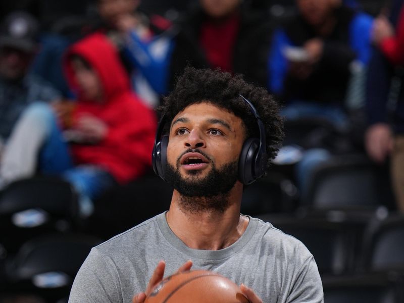 DENVER, CO - JANUARY 3: Jamal Murray #27 of the Denver Nuggets warms up before the game against the San Antonio Spurs on January 3, 2025 at Ball Arena in Denver, Colorado. NOTE TO USER: User expressly acknowledges and agrees that, by downloading and/or using this Photograph, user is consenting to the terms and conditions of the Getty Images License Agreement. Mandatory Copyright Notice: Copyright 2025 NBAE (Photo by Bart Young/NBAE via Getty Images)