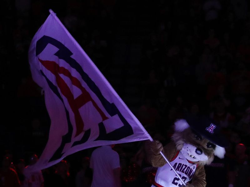 Jan 5, 2023; Tucson, Arizona, USA; Wilbur waves the Arizona flag at mid court during introductions at McKale Center. Mandatory Credit: Zachary BonDurant-USA TODAY Sports