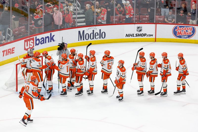 Nov 19, 2024; Chicago, Illinois, USA; Anaheim Ducks players celebrate after defeating the Chicago Blackhawks in a hockey game at United Center. Mandatory Credit: Kamil Krzaczynski-Imagn Images