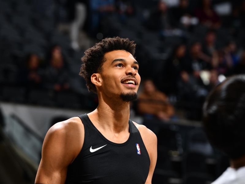 SAN ANTONIO, TX - JANUARY 15: Victor Wembanyama #1 of the San Antonio Spurs smiles while warming up before the game against the Memphis Grizzlies on January 15, 2025 at the Frost Bank Center in San Antonio, Texas. NOTE TO USER: User expressly acknowledges and agrees that, by downloading and or using this photograph, user is consenting to the terms and conditions of the Getty Images License Agreement. Mandatory Copyright Notice: Copyright 2025 NBAE (Photos by Barry Gossage/NBAE via Getty Images)